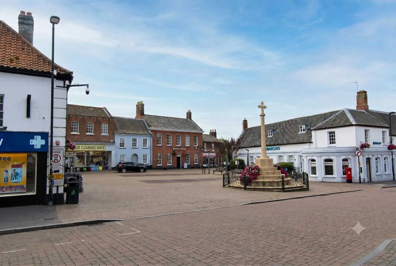 Photo of Fakenham town centre. The original image is from wikipedia, this image was cleaned up with Gemini and optimised for the web.